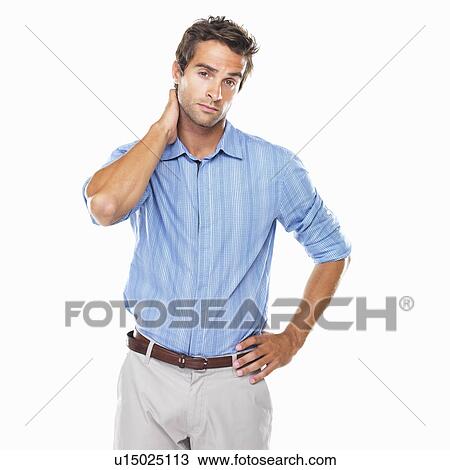 Stock Image - Portrait of business man standing with hand behind neck. Fotosearch