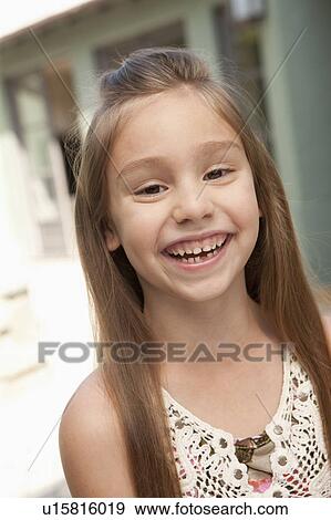 Stock Photo - Portrait of cheerful girl (6-7). Fotosearch