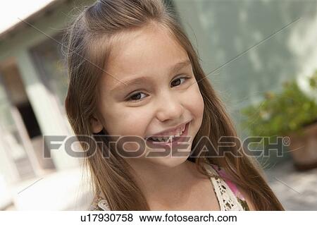 Stock Photo - Portrait of cheerful girl (6-7). Fotosearch