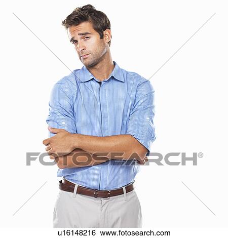 Stock Photograph - Portrait of curious executive standing with hands folded. Fotosearch