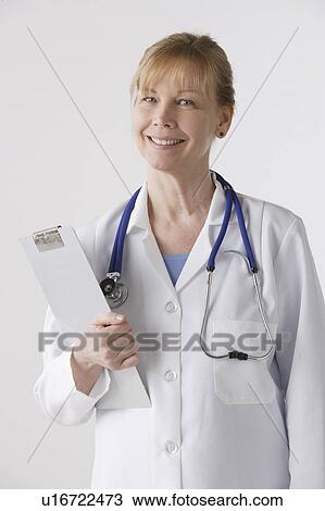 Portrait of female doctor, studio shot View Large Photo Image Stock Image - Portrait of female doctor, studio shot. Fotosearch