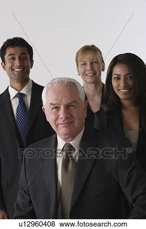 Portrait of four business people, studio shot View Large Photo Image Stock Photo - Portrait of four business people, studio shot. Fotosearch
