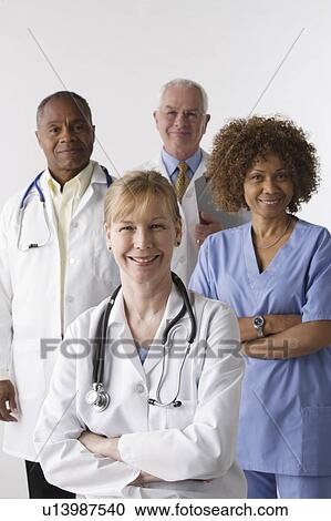 Portrait of four medical professionals, studio shot View Large Photo Image Stock Image - Portrait of four medical professionals, studio shot. Fotosearch
