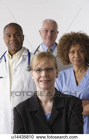 Portrait of four medical professionals, studio shot View Large Photo Image Stock Image - Portrait of four medical professionals, studio shot. Fotosearch
