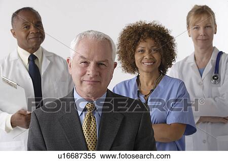 Portrait of four medical professionals, studio shot View Large Photo Image Stock Photography - Portrait of four medical professionals, studio shot. Fotosearch