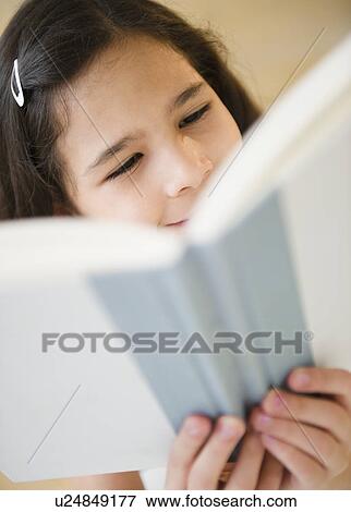 Portrait of girl (10-11) reading book View Large Photo Image Stock Photo - Portrait of girl (10-11) reading book. Fotosearch
