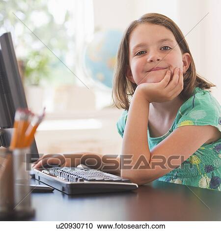 Portrait of girl (6-7) using computer in classroom View Large Photo Image Stock Image - Portrait of girl (6-7) using computer in classroom. Fotosearch
