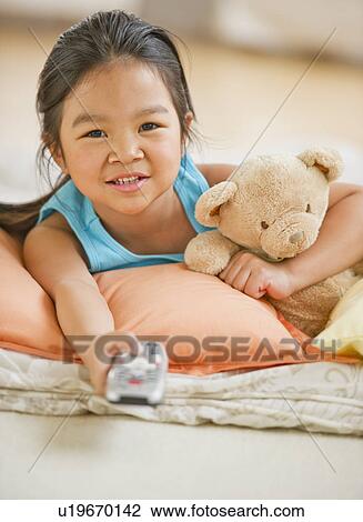 Portrait of girl (6-7) watching TV View Large Photo Image Stock Image - Portrait of girl (6-7) watching TV. Fotosearch