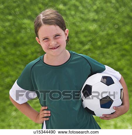 Portrait of girl (6-7) with soccer ball View Large Photo Image Stock Image - Portrait of girl (6-7) with soccer ball. Fotosearch