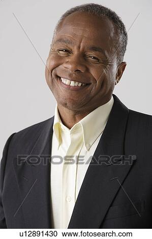 Portrait of mature businessman, studio shot View Large Photo Image Stock Image - Portrait of mature businessman, studio shot. Fotosearch