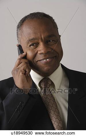 Portrait of mature businessman, studio shot View Large Photo Image Stock Image - Portrait of mature businessman, studio shot. Fotosearch