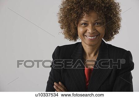 Picture - Portrait of mature businesswoman, studio shot. Fotosearch