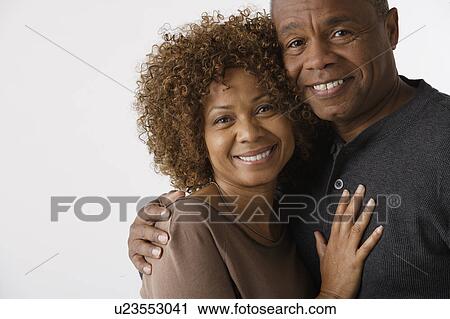 Portrait of mature couple, studio shot View Large Photo Image Stock Image - Portrait of mature couple, studio shot. Fotosearch