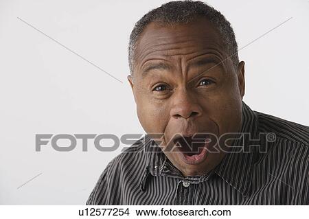 Picture - Portrait of mature man, studio shot. Fotosearch