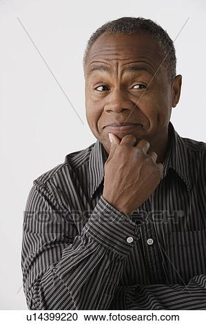 Portrait of mature man, studio shot View Large Photo Image Stock Image - Portrait of mature man, studio shot. Fotosearch