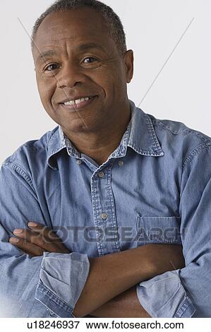 Stock Photo - Portrait of mature man, studio shot. Fotosearch