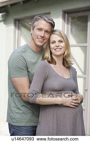 Stock Image - Portrait of pregnant woman with husband. Fotosearch