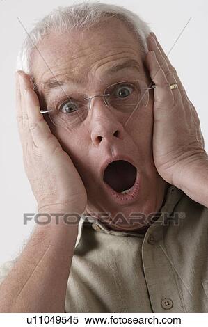 Stock Photography - Portrait of senior man, studio shot. Fotosearch