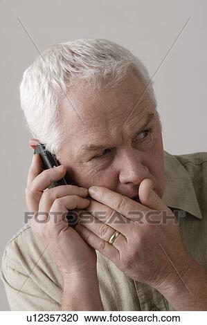 Portrait of senior man with mobile phone, studio shot View Large Photo Image Stock Image - Portrait of senior man with mobile phone, studio shot. Fotosearch
