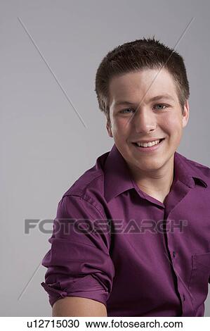 Portrait of smiling teenager, studio shot View Large Photo Image Stock Image - Portrait of smiling teenager, studio shot. Fotosearch