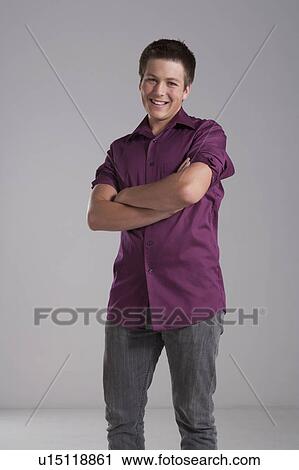 Portrait of smiling teenager, studio shot View Large Photo Image Stock Image - Portrait of smiling teenager, studio shot. Fotosearch