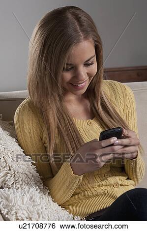 Portrait of teenage girl (16-17) with mobile phone View Large Photo Image Stock Photograph - Portrait of teenage girl (16-17) with mobile phone. Fotosearch