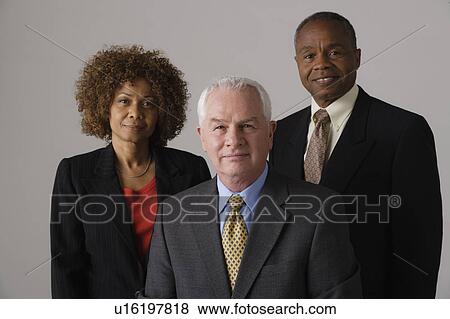 Portrait of three business people, studio shot View Large Photo Image Stock Photo - Portrait of three business people, studio shot. Fotosearch