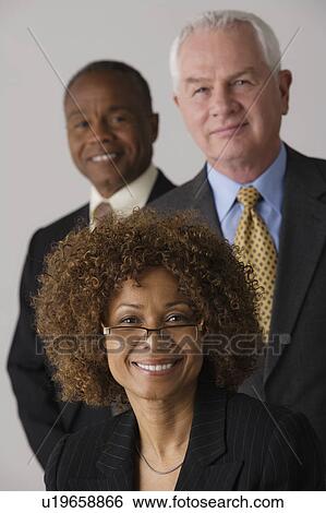 Portrait of three business people, studio shot View Large Photo Image Stock Photograph - Portrait of three business people, studio shot. Fotosearch