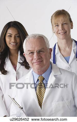 Portrait of three medical professionals, studio shot View Large Photo Image Stock Image - Portrait of three medical professionals, studio shot. Fotosearch