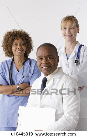 Stock Photo - Portrait of three medical professionals, studio shot. Fotosearch