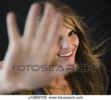 Portrait of woman covering camera View Large Photo Image Stock Photo - Portrait of woman covering camera. Fotosearch