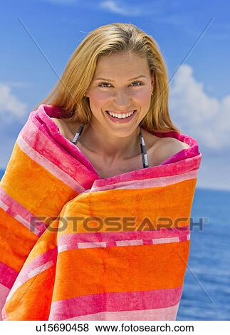 Stock Photo - Portrait of woman wrapped in towel. Fotosearch