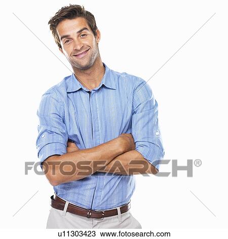 Portrait of young business man standing with hands folded and smiling View Large Photo Image Stock Image - Portrait of young business man standing with hands folded and smiling. Fotosearch