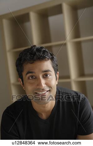 Picture - Portrait of young businessman, studio shot. Fotosearch