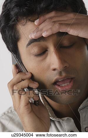 Picture - Portrait of young man, studio shot. Fotosearch