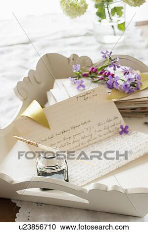 Quill pen with letters and flowers View Large Photo Image Stock Image - Quill pen with letters and flowers. Fotosearch