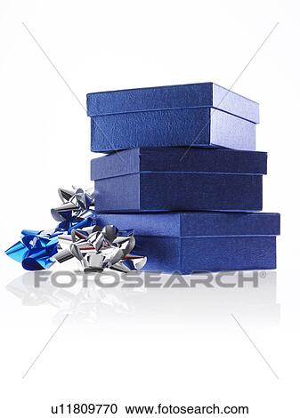 Stock Image - Stack of blue boxes with ribbons, studio shot. Fotosearch