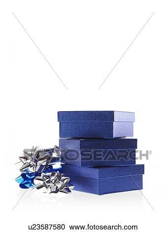 Stock Image - Stack of blue boxes with ribbons, studio shot. Fotosearch
