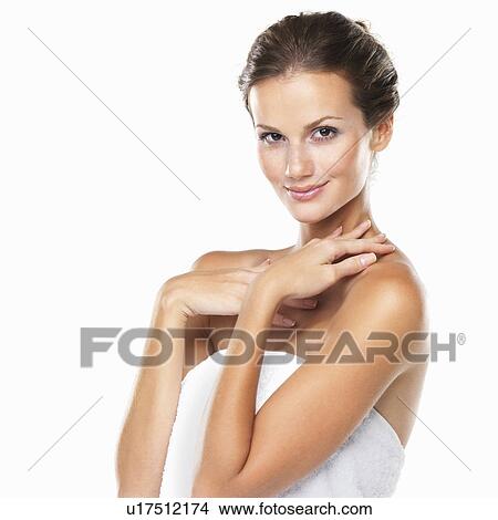 Studio portrait of beautiful woman wrapped in towel View Large Photo Image Picture - Studio portrait of beautiful woman wrapped in towel. Fotosearch