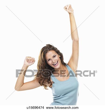 Picture - Studio portrait of beautiful woman with fists clenched in victory. Fotosearch