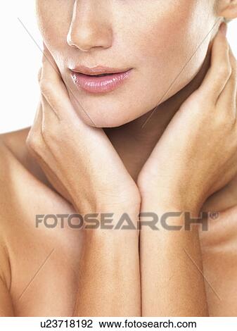 Studio portrait of beautiful woman with hands over neck View Large Photo Image Stock Image - Studio portrait of beautiful woman with hands over neck. Fotosearch