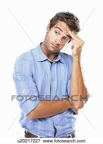 Studio portrait of business man rubbing forehead and looking away View Large Photo Image Stock Photo - Studio portrait of business man rubbing forehead and looking away. Fotosearch