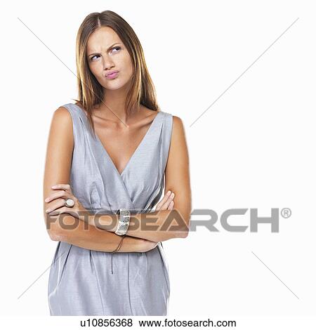 Stock Photo - Studio portrait of elegant woman with pursed lips. Fotosearch