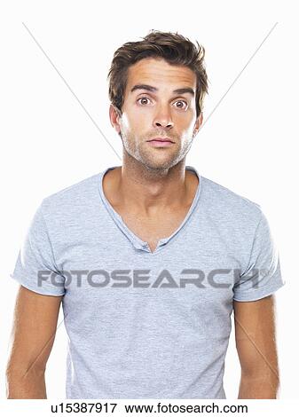 Studio portrait of man with eyes wide open View Large Photo Image Stock Photo - Studio portrait of man with eyes wide open. Fotosearch