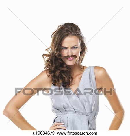 Studio portrait of playful woman with moustache made of hair View Large Photo Image Stock Photo - Studio portrait of playful woman with moustache made of hair. Fotosearch