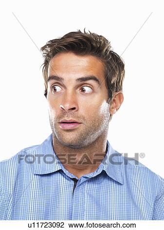 Stock Image - Studio portrait of surprised business man looking away. Fotosearch