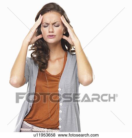 Stock Photo - Studio portrait of with head in hands. Fotosearch