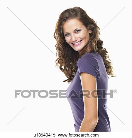 Stock Photography - Studio portrait of young attractive woman smiling. Fotosearch