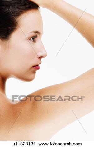 Stock Image - Studio portrait of young woman. Fotosearch