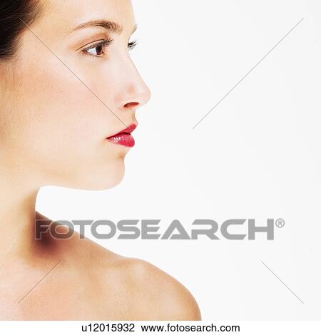 Stock Image - Studio portrait of young woman. Fotosearch